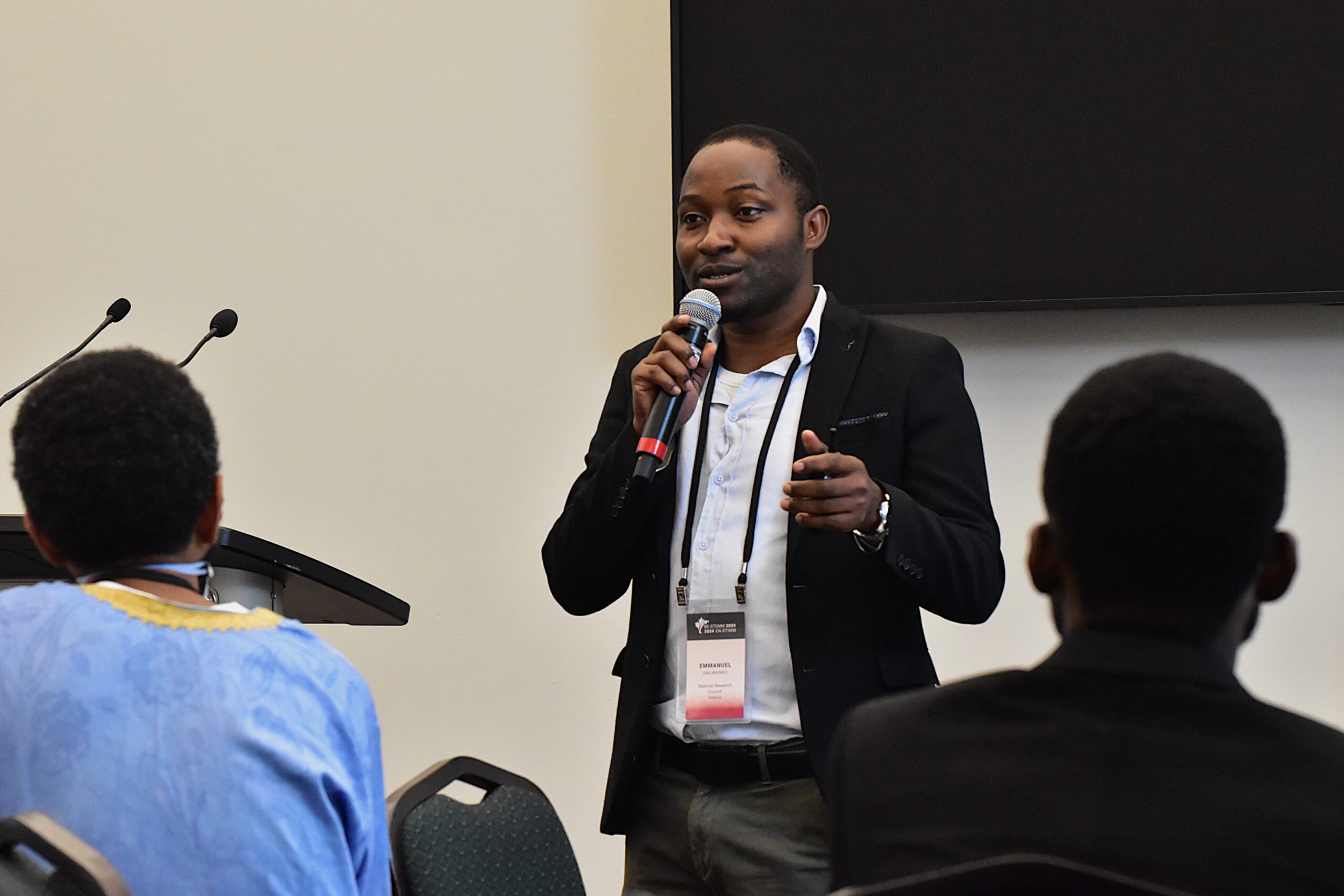 Person speaking at a microphone